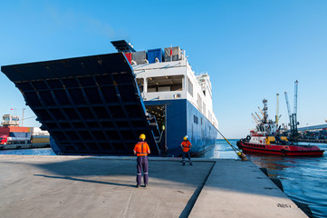 Open Stern Quarter Ramp Ferry and workers at Port in Mersin, Turkey