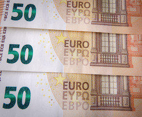 Closeup of fifty euro bills. European euro banknotes background.