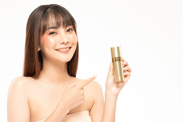 Obraz na płótnie Canvas Beauty asian woman brown hair looking smile in camera happiness and hold bottle cosmetic cream lotion and cheerful with make up brush,Beauty Concept on white background.