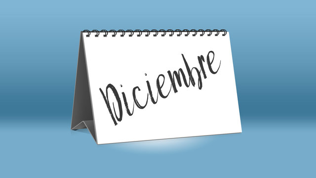 Ein Kalender für den Schreibtisch zeigt den spanischen Monat Diciembre (Dezember in deutscher Sprache)