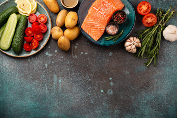 Raw salmon fillet and vegetables
