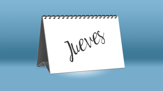 Ein Kalender für den Schreibtisch zeigt den spanischen Wochentag Jueves (Donnerstag in deutscher Sprache)