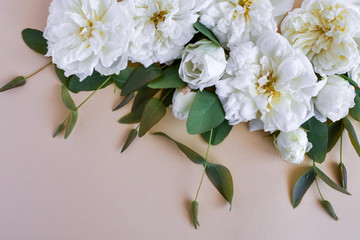 Stylized stock photo, decorative still lifes, flower compassion. Wedding or holiday bouquet of white roses and branches of a young eucalyptus. Concept of Mother’s Day, Family Day, Valentine’s Day. 