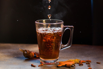 Grog in the cup, tea and rum with cinnamon and clove  