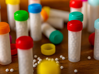 white homeopathic pills/globules