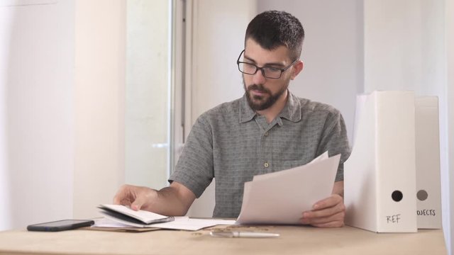 Confused frustrated young man reading letter, debt notification, bad financial report, money problem
Confused frustrated young man holding mail letter reading and solving problems