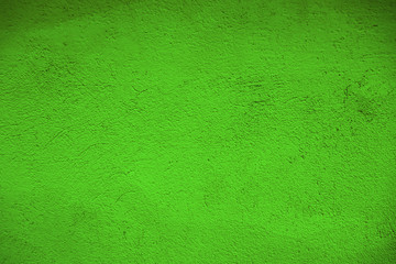 Green wall texture or backdrop. Green background for text and design. Green purple wall