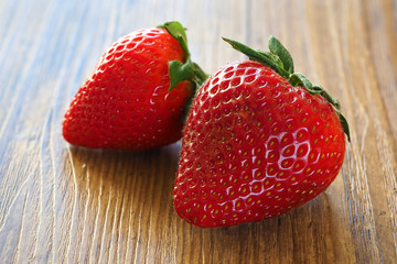 Strawberry berries close-up on a wooden table