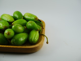 Averrhoa bilimbi on the wood plate in white background