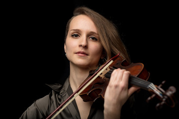 Serious violinist during a classic performance