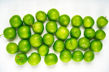 Green sour plum. Greengage on isolated on white background. Top view. Copy space for text message.