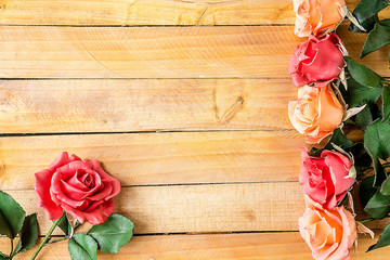 Handmade roses layout on wooden background. Background layout with free text space.