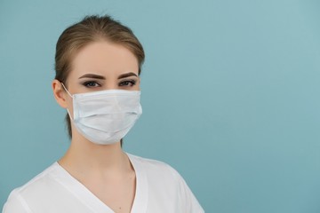 large doctor or nurse in a mask on a blue background