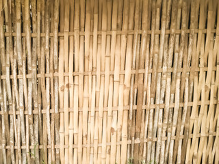 Bamboo dry sheet curtain tied with light wood tone background. Texture