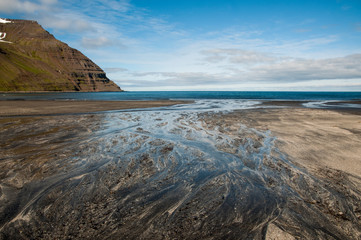 patterns in volcanic sand at beach