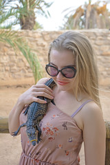 young woman with crocodile