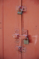 metal garage doors with multiple padlocks