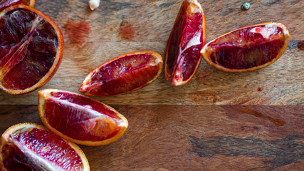 Slices of red oranges on wooden Board
