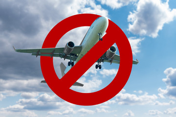 Aircraft with a prohibition sign. Symbol of the prohibition of air travel during the coronavirus...