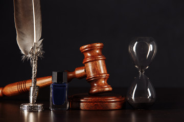 Notary's public pen, hourglass and stamp on testament and last will. Notary public tools.