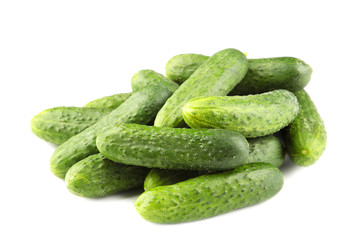 Many green cucumbers isolated on white background. Top view