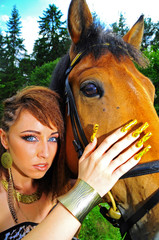 Obraz premium young girl with beautifuil nails & horse