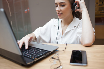 A student takes online courses in a group or with a personal teacher. E-learning