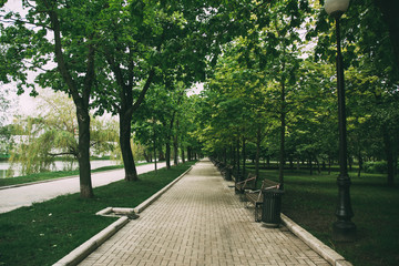 closed park in Moscow, benches wrapped in red ribbon, no seating, quarantine 