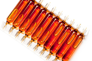 Packing of glass ampoules with a medical preparation shot on a white background.