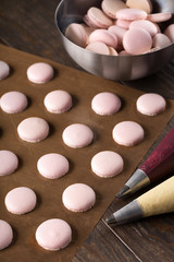 Process of making macaroons, dark background