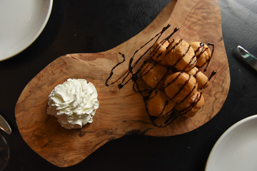 Dessert served on a wooden board