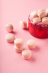 Pink macaroons in red gift box