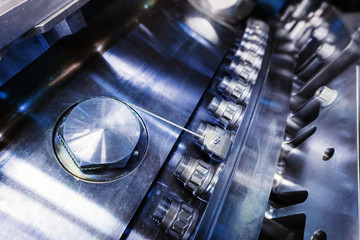 A detailed view of the gas turbine engine for generating electricity, shows the bolt connection design and the pipe laying outside.