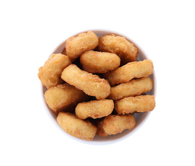 Bucket with tasty chicken nuggets isolated on white, top view