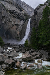 waterfall in Yosemite National Park in sunny weather blue sky with clouds