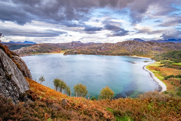 Fototapeta premium Gruinard Bay, Achnasheen in the dramatic highlands of scenic Scotland, fantastic adventure travel destination or holiday vacation to view picturesque scenery at sunrise or sunset