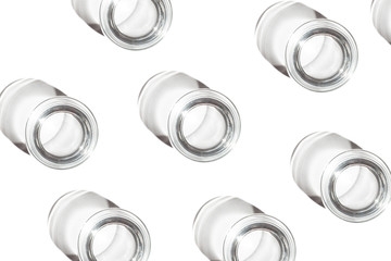 A glass with a strong shadow on a white background . Сlose-up. Poster.