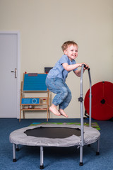 Pediatric Sensory Integration Therapy - a boy jumping on the trampoline