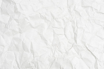 Texture of a crumpled sheet of white paper as a background