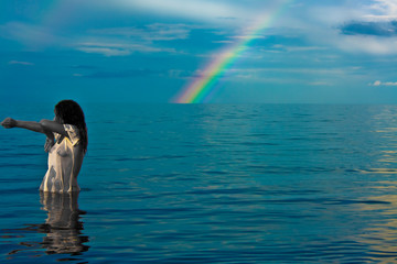 naked young woman and rainbow