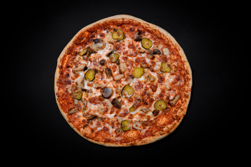 crispy Italian delicious pizza on a black background, pizza ingredients, photo for recipe and menu