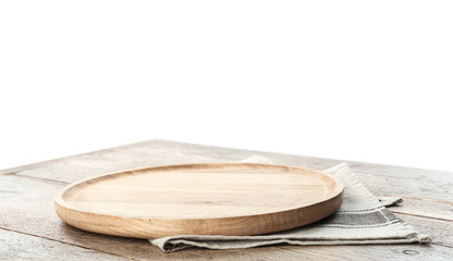 Empty plate and napkin on wooden table against white background