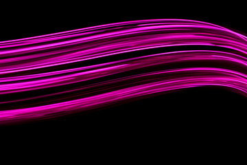 Long exposure photograph of neon pink colour in an abstract swirl, parallel lines pattern against a...