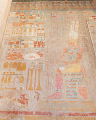 Hieroglyphic carvings on an ancient egyptian temple wall