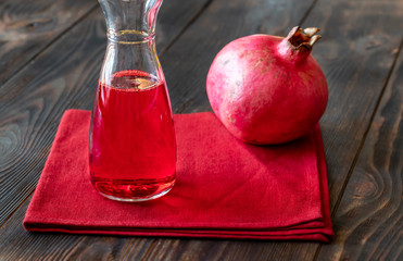 Glass jug of grenadine syrup