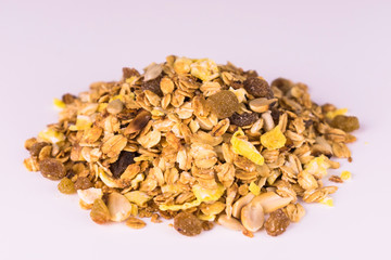 A pile of granola on a white background. Useful food.