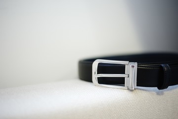
accessories of a young male businessman: tie, cufflinks, belt