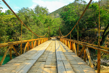 Fototapeta na wymiar Bridge next to Semuc champey natural park in Cahabon river