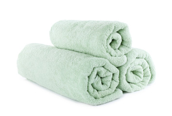 Fresh rolled light towels isolated on white