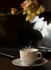 A glass of strawberry cocktail on a wooden background